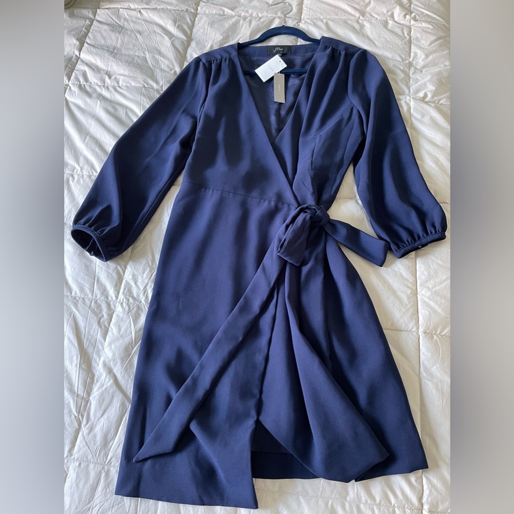 J Crew brand new women’s wrap dress. With tags. Very flattering. Women’s 14